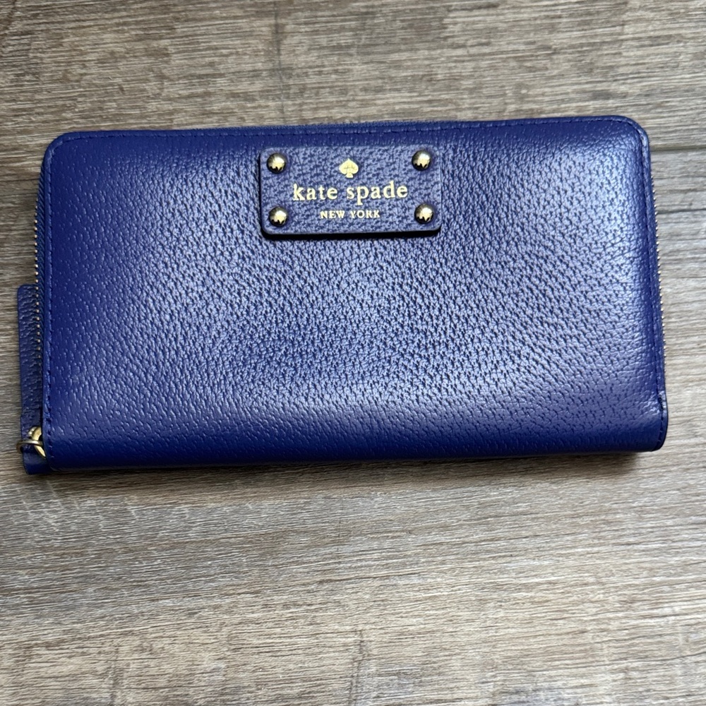 kate spade pebbled leather zip-around wallet in cobalt blue with gold hardware